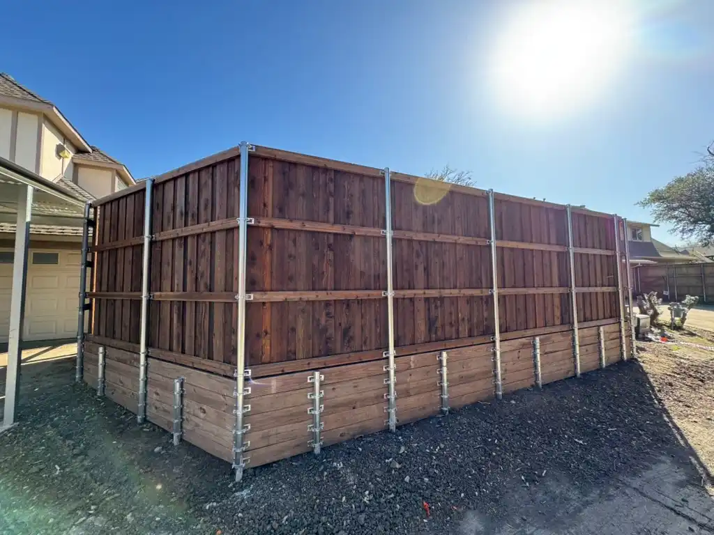 Custom wood privacy fence with retaining wall