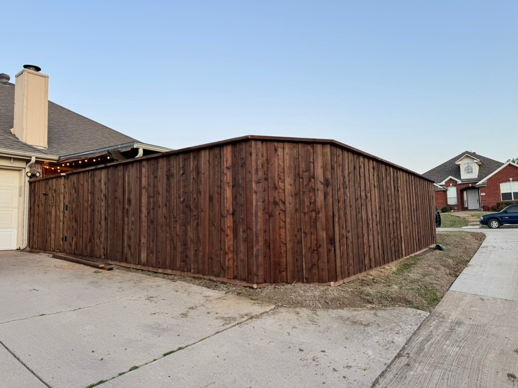 Board-on-board cedar fence with decorative top cap in Flower Mound